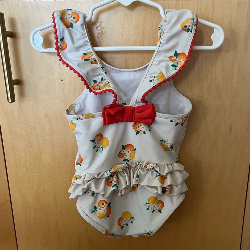 Kate Spade white Capistrano orange print ruffle butt swimsuit size 24 months